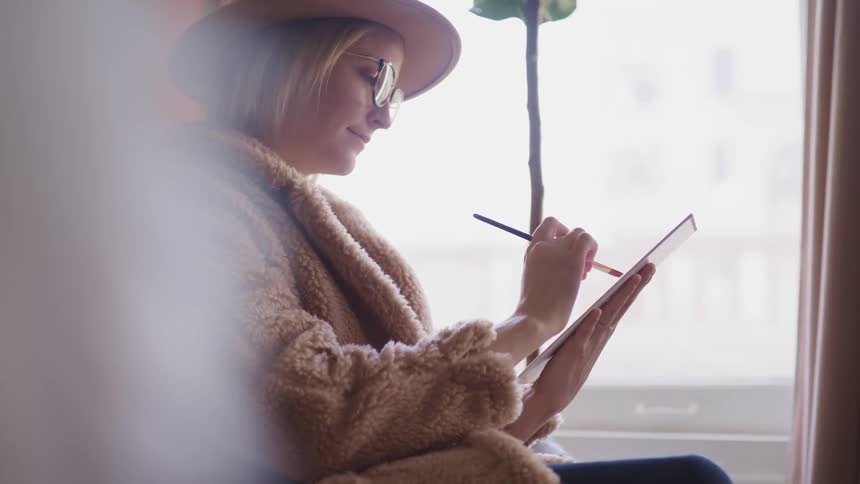 A woman is painting indoors
