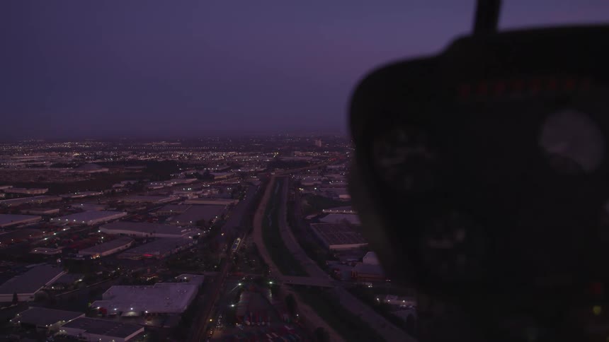 Highway sits near the city buildings at night