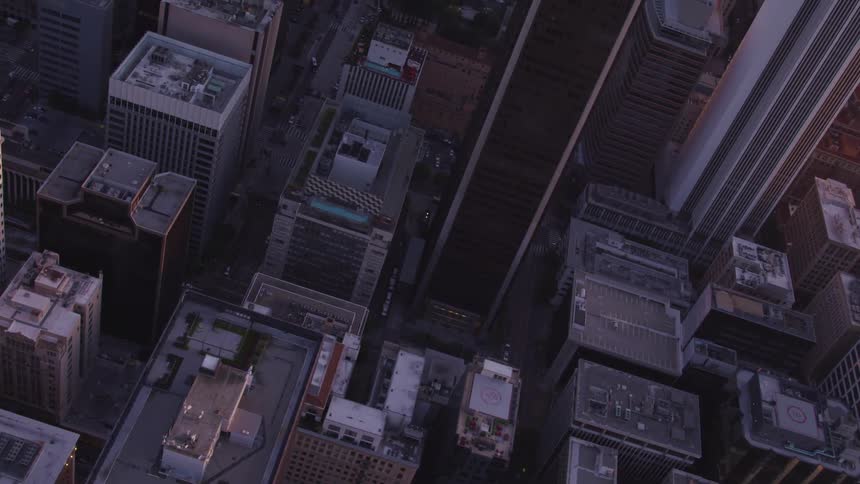 An aerial view of a downtown city is displayed