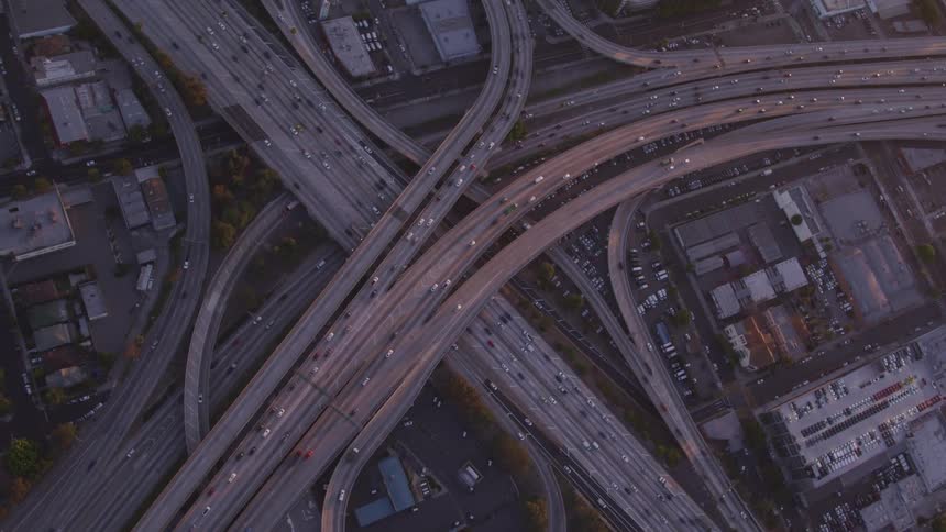 Vehicles driving on freeways and overpasses in a city