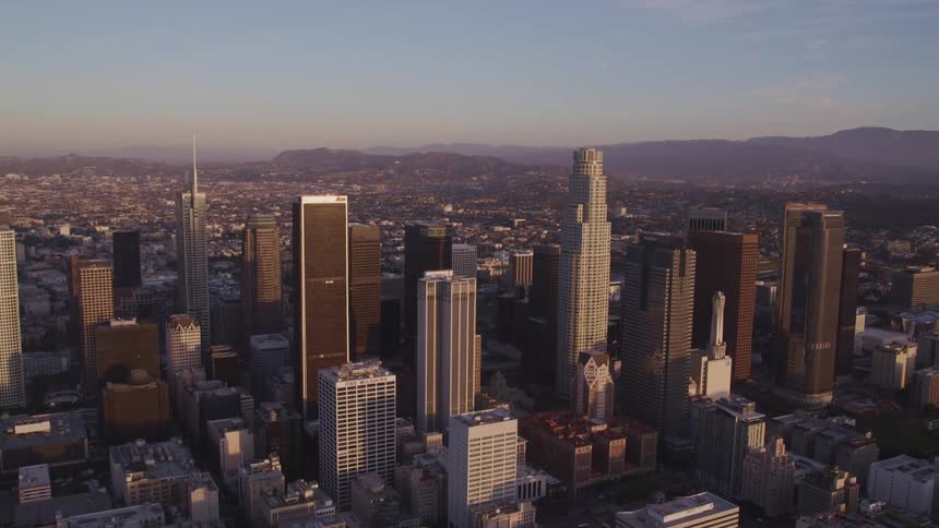 An aerial view of a downtown city is displayed