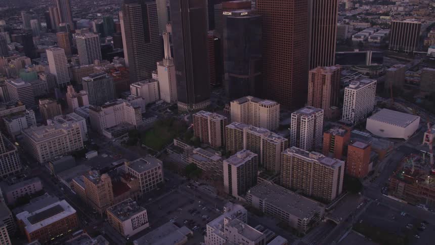 Aerial view of high rise buildings and towers at dusk