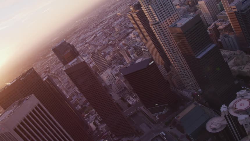 A downtown city is displayed at dusk