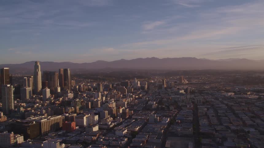 An aerial view of skyscrapers in a large city in the daytime