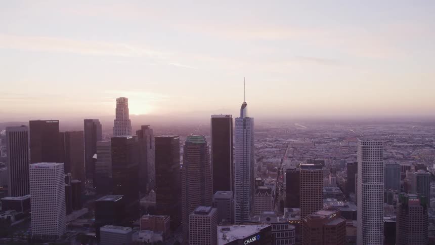 An aerial view of a downtown city is displayed