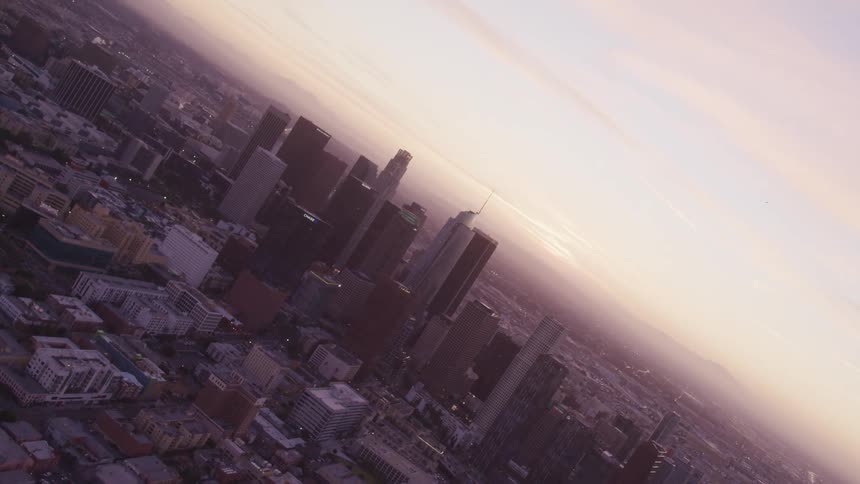A view of an urban city at dusk is displayed