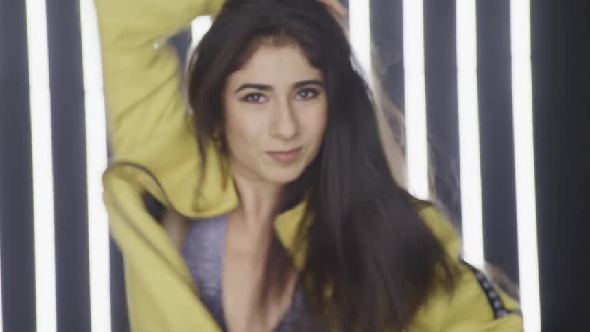 A woman is dancing in a room