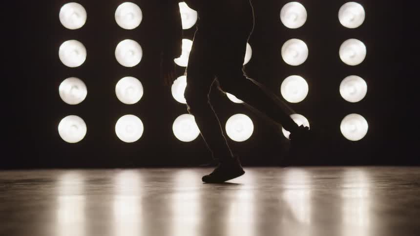 A person is dancing indoors