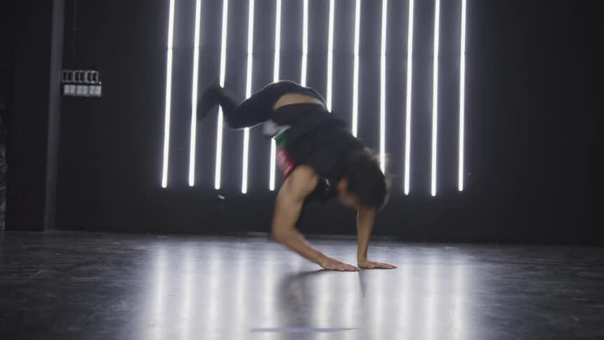 A teenage boy dancing on stage
