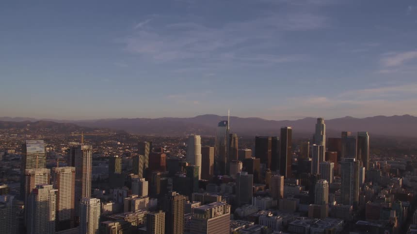 An aerial view of a downtown city is displayed