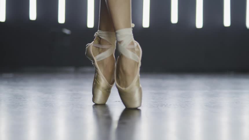 A ballerina walking on her toes