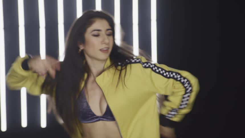 A teenage girl dancing on a stage