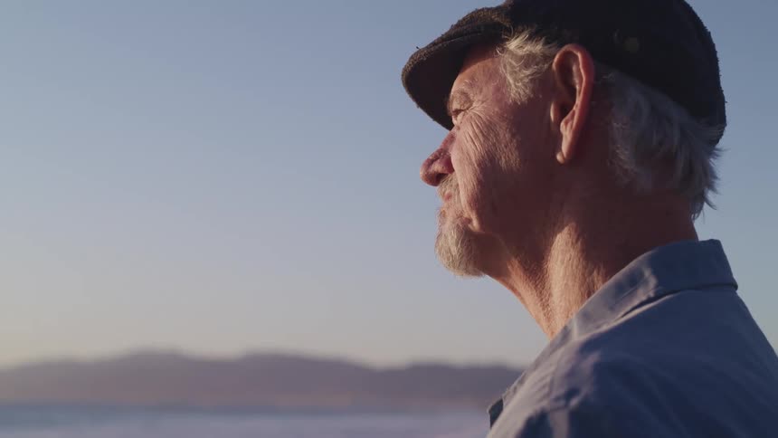 A man looking out at the water