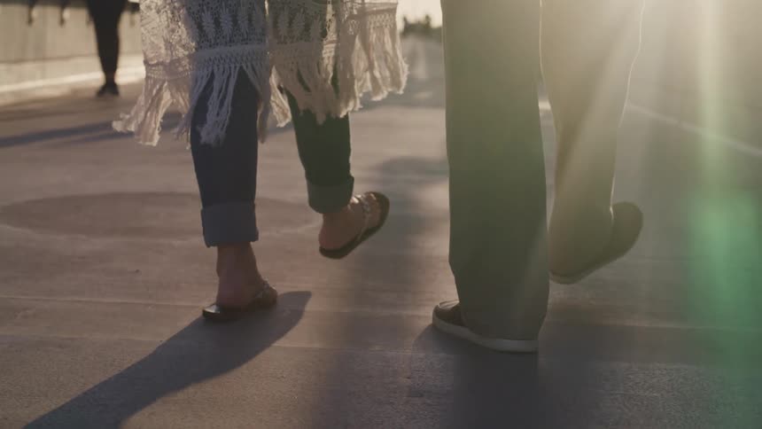 People walking across a bridge