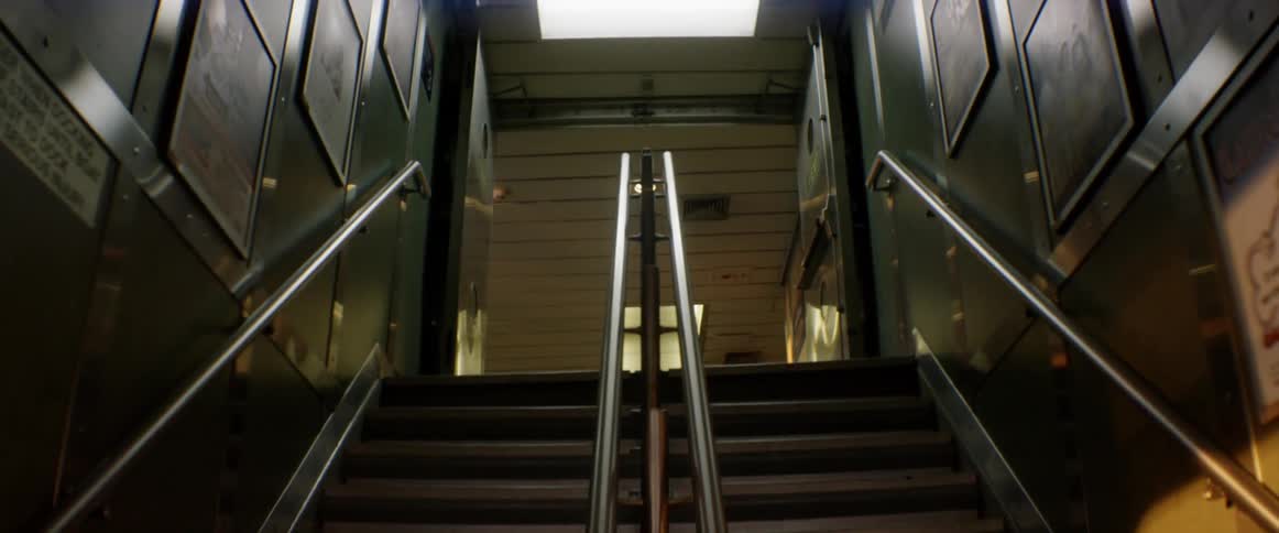 A double flight of stairs leading up to the next floor of a school