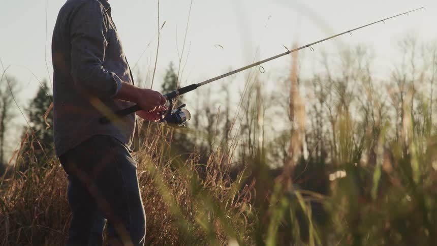 A man reels in his fishing rod