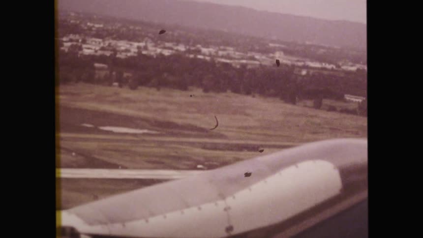 An airport lifts off from the runway of an airport on a foggy day