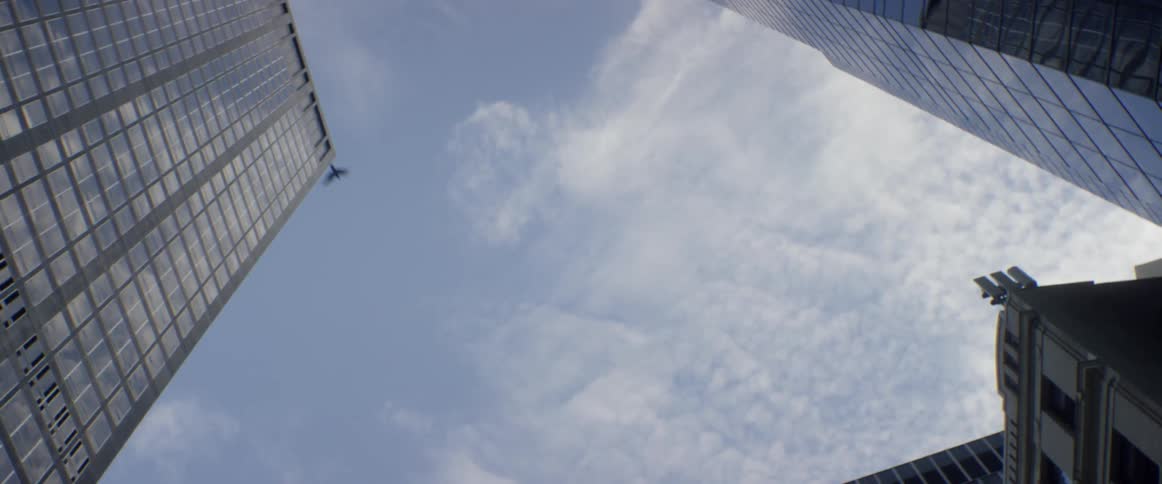 A bird flies between two skyscrapers