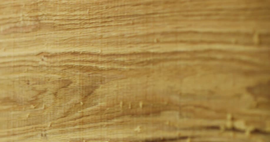 Close up of a plank being cut from a block of wood