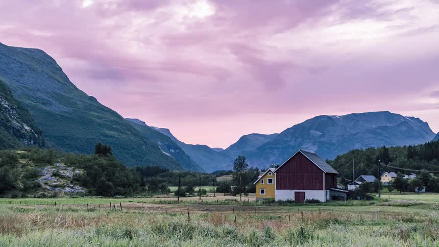 Clouds float over a small rural town in the early morning