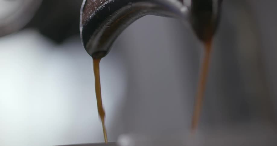 Coffee pours into the mug