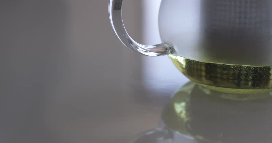 Liquid is being poured into a pitcher