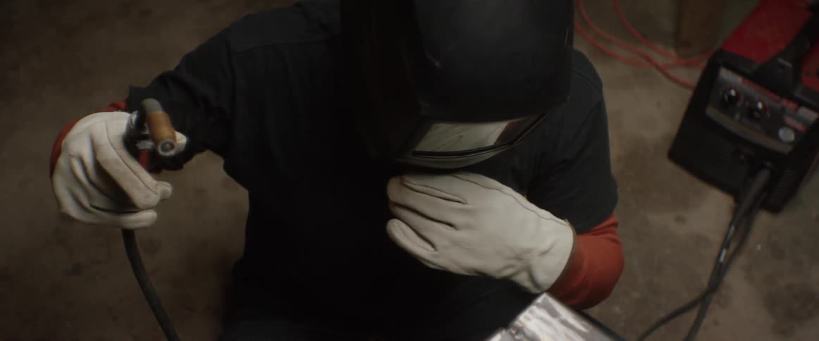 A welder prepares to weld