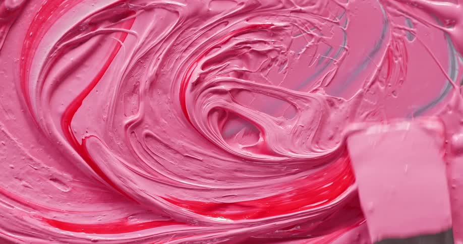 Blending paint with a metal spatula on a metal tray
