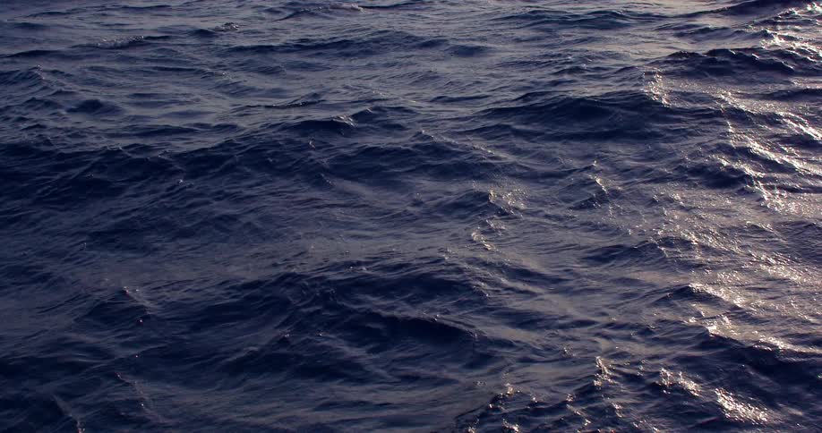 Waves on a vast blue ocean in the daytime
