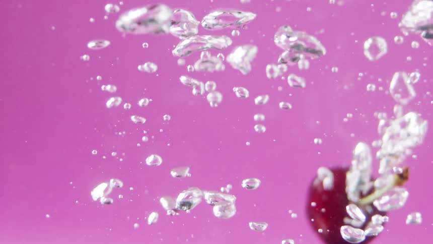 Cherries falling in to water