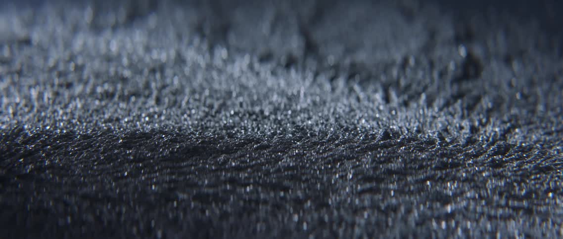 Powder iron filing moving under a magnetic field
