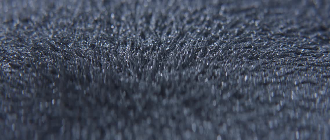 Metal filings moving under a magnetic field