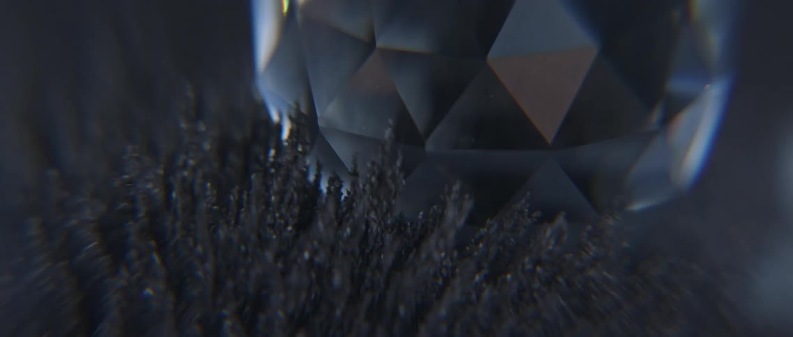 A crystal ball is laying in some moving fabric