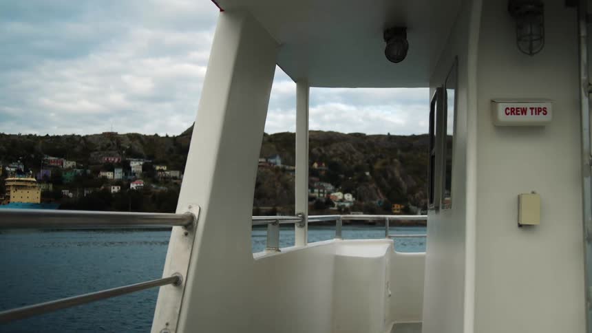 A ferry boat enters a harbour