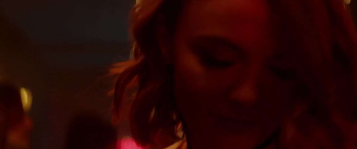 A young woman dances in a bar