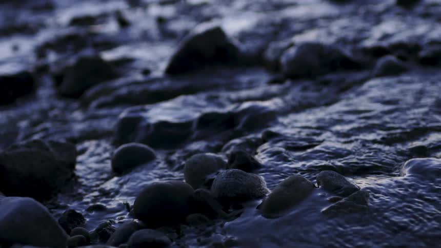 Water flowing over rocks in a river