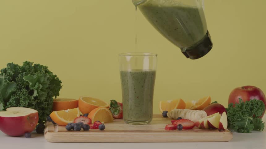 The glass is filled with a smoothie
