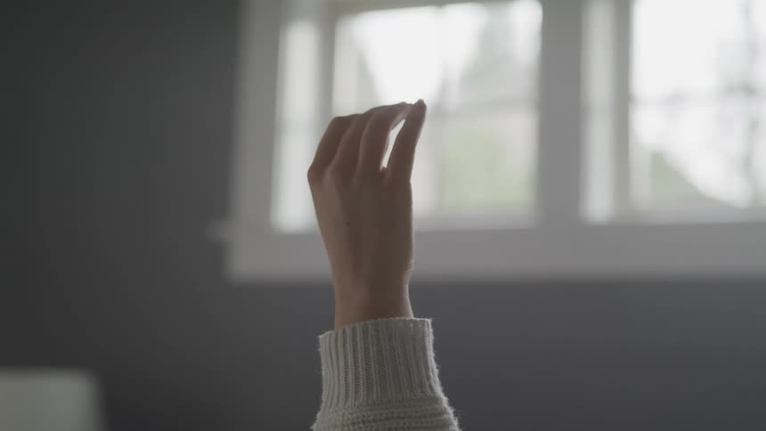A hand moving slightly raised in the air
