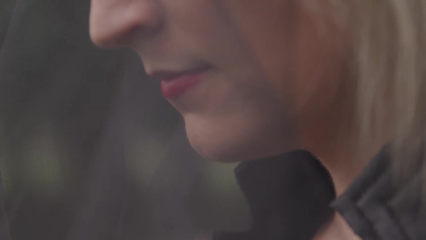 Very close up of a woman outdoors