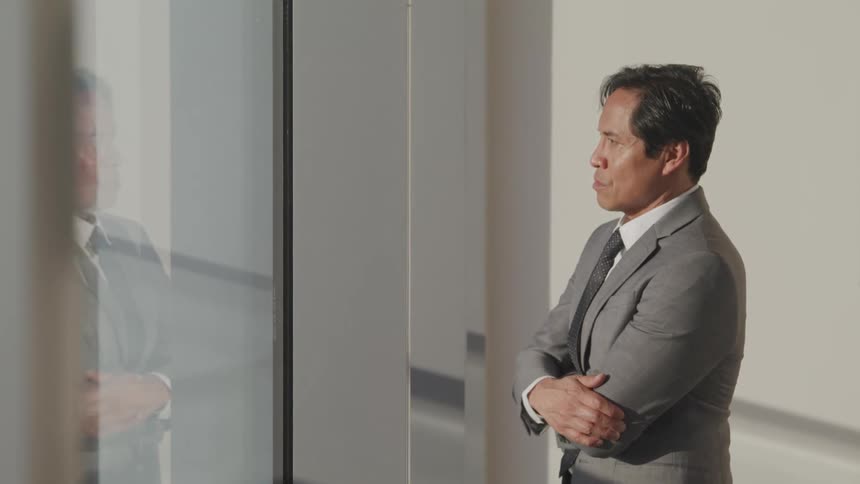 A man is standing in an office building