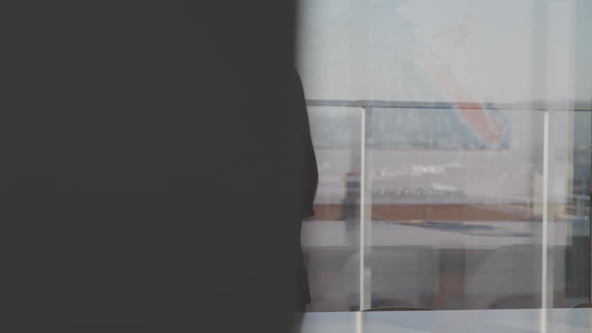 A woman walks through the conference room