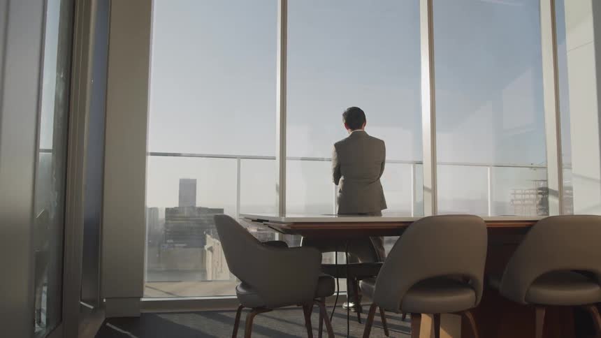 A man is standing in an office building