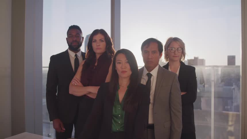 A group of coworkers pose for a photo