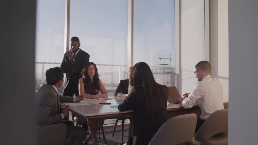 People are having a meeting in a conference room