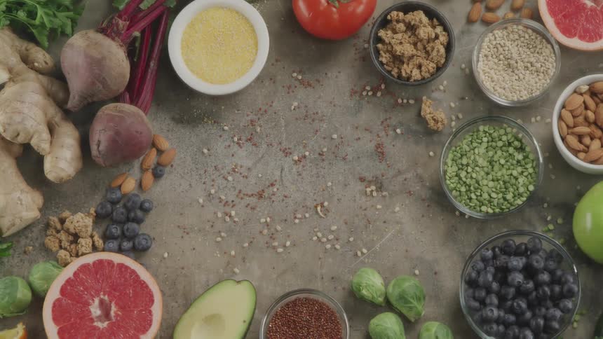Top down view of various types of vegetarian food over a table