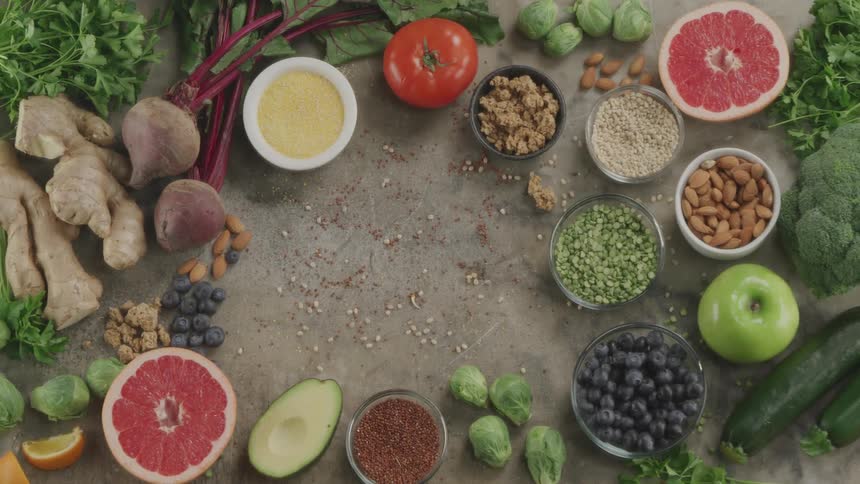 An assortment of healthy vegetarian foods covering a table