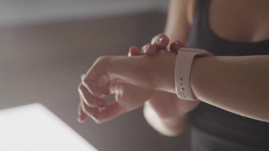 A woman is looking at her watch