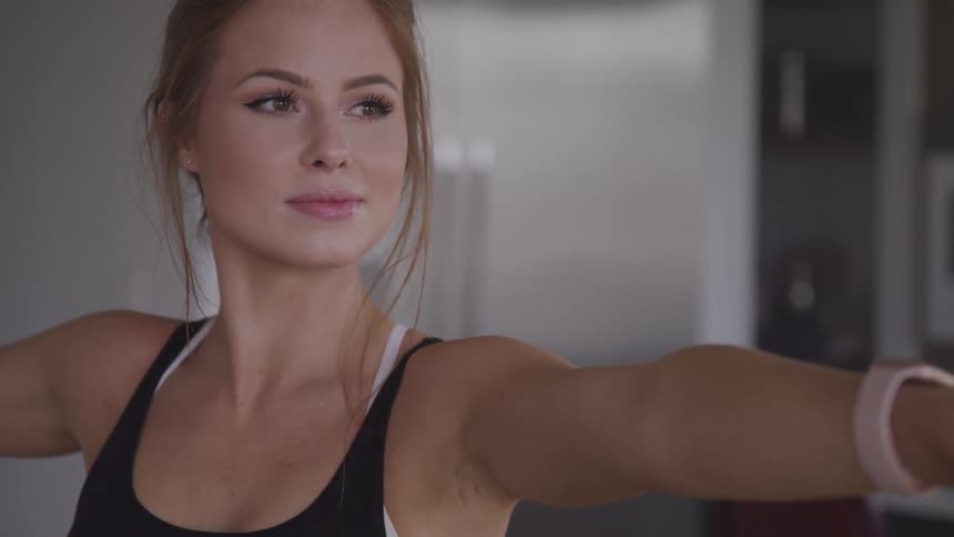 A woman is stretching and doing yoga
