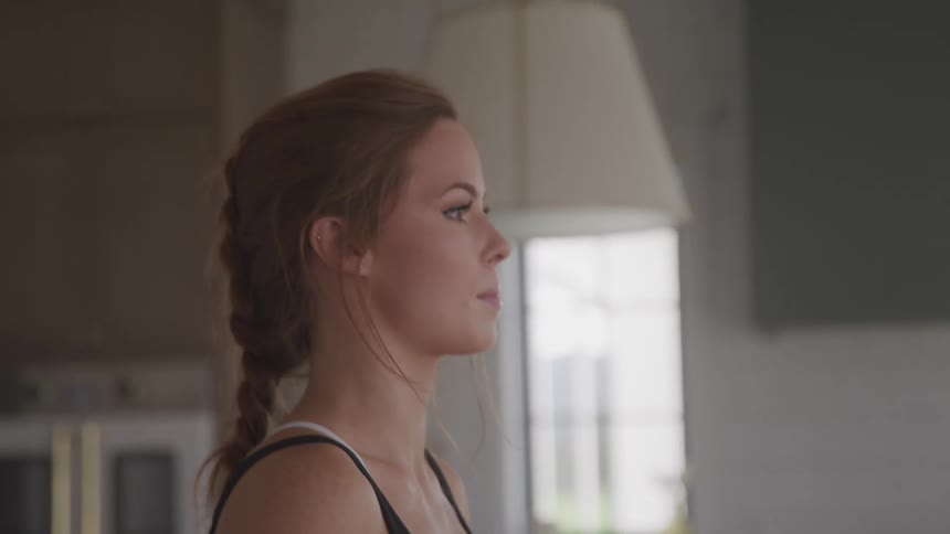 A woman is working out in a room