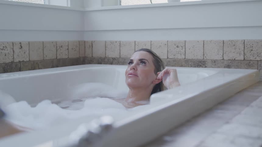 A woman soaking in a bath tub